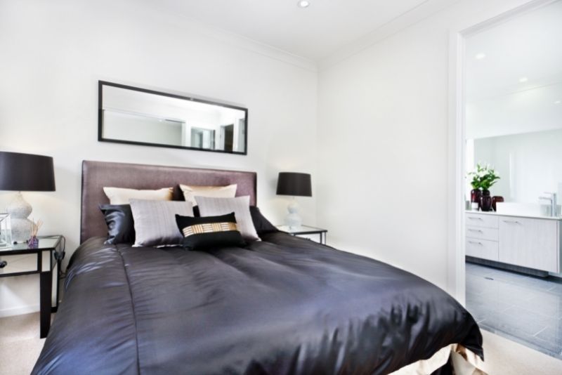 bathroom area on the left side of the bed